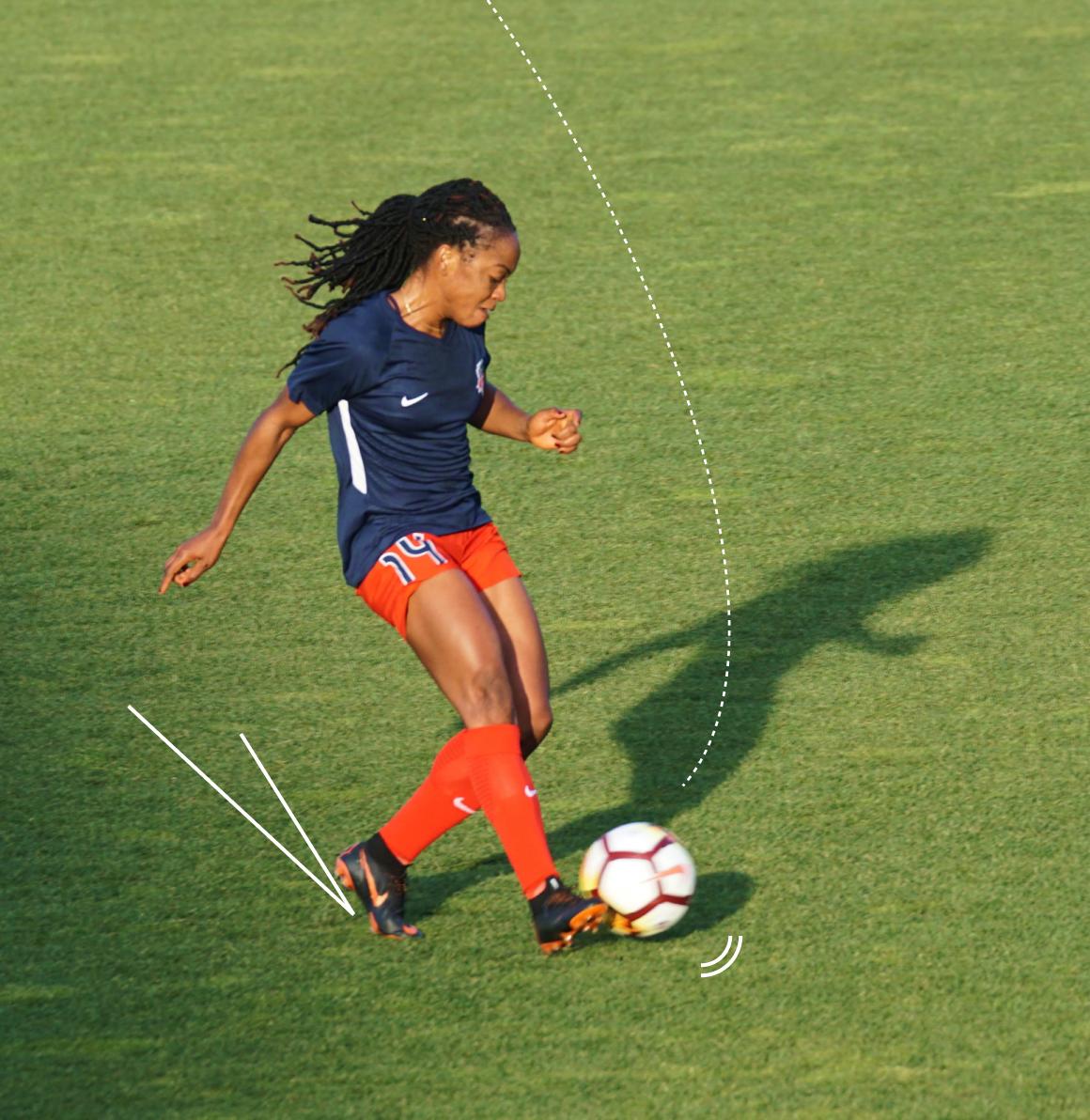 Woman kicking a football (soccer), with lines to indicate the direction of movement and the sound that would be occurring.
